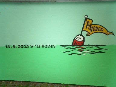 painting on a wall with the date 14-8-2002 which showed the highest level of the flood