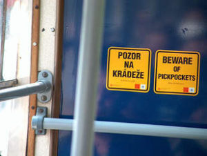 prague bus sign saying beware of pickpockets