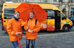 prague hop on hop off bus, two girls with orange umbrella