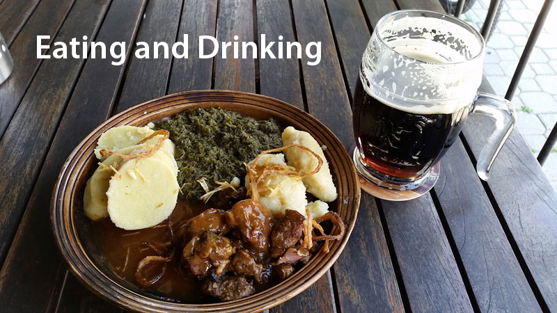 czech food and beer on a bench table