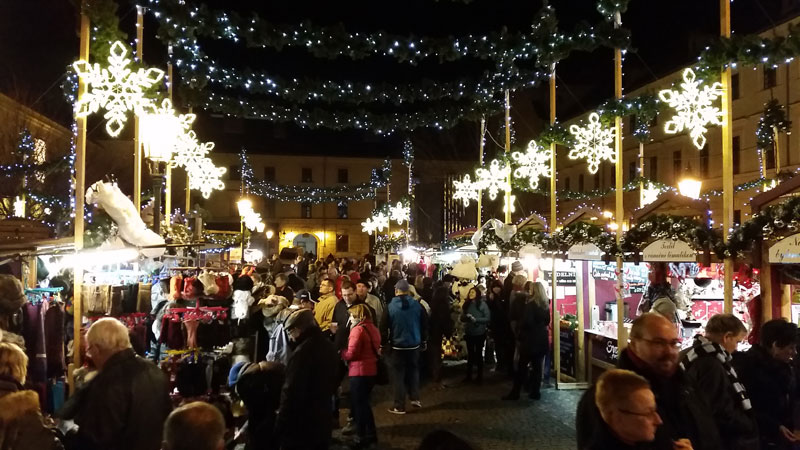 republic square old christmas market stalls at night with overhead decoration