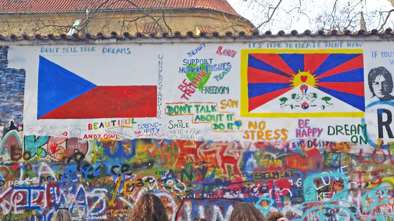 prague john lennon wall graffiti with czech and tibetan flags at the time of the visit of the chinese premier in march 2016