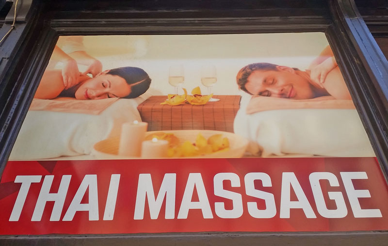 sign with couple saying thai massage