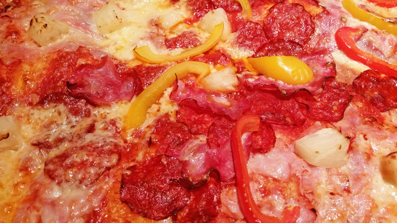 detail of topping on a pizza