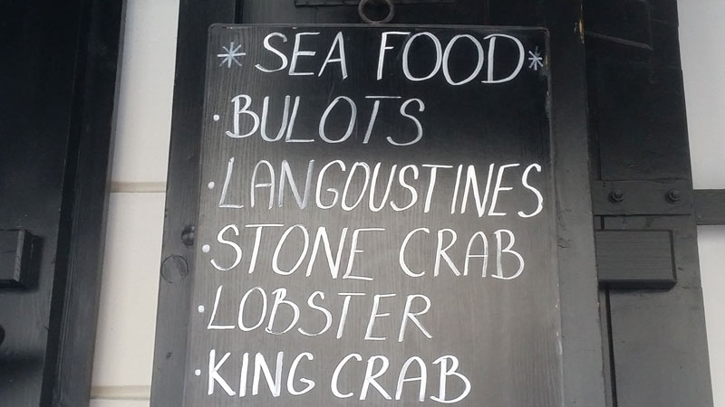 blackboard sign showing fish and seafood