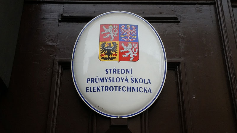 sign on a school in prague which says middle school for electro-technical studies