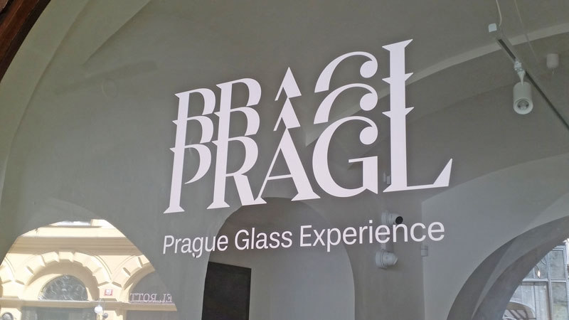 window with sign saying pragl glass experience