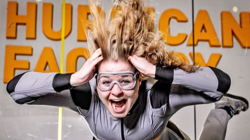 prague indoor skydiving lady with goggles in a wind tunnel