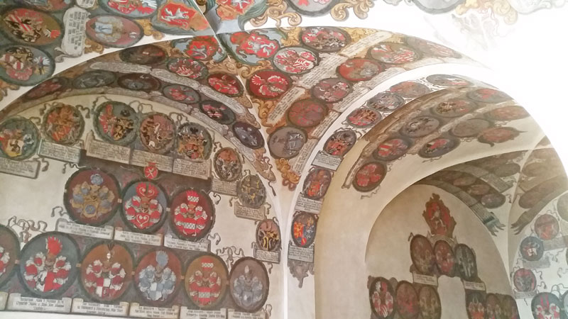 coats of arms on a gothic vaulted ceiling