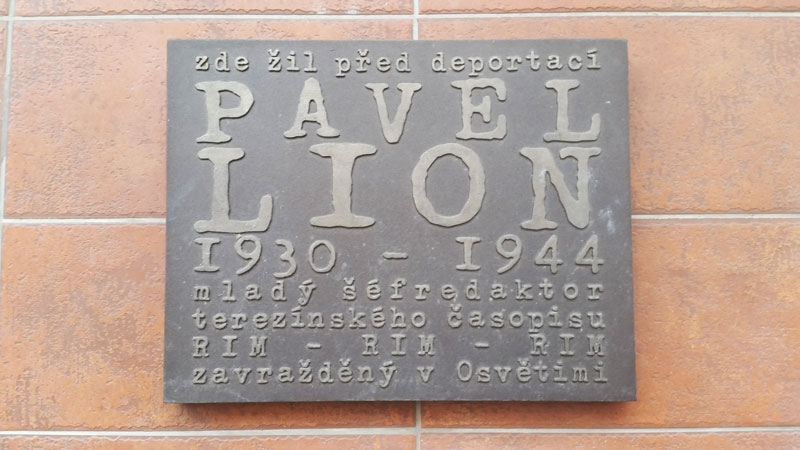 plaque on a wall in prague dedicated to pavel lion 1930-1944