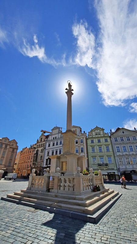 Prague Marian Column with blue sky background and wispy clouds