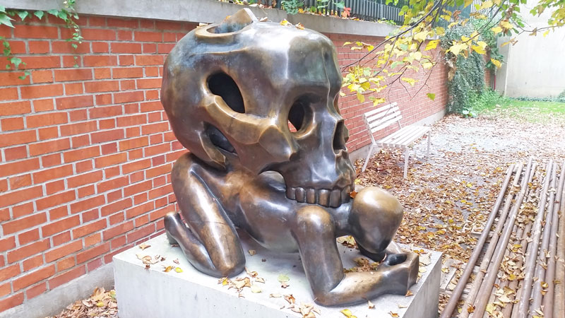 jaroslav rona bronze sculpture called parable with skull in the rear garden of st agnes convent in prague