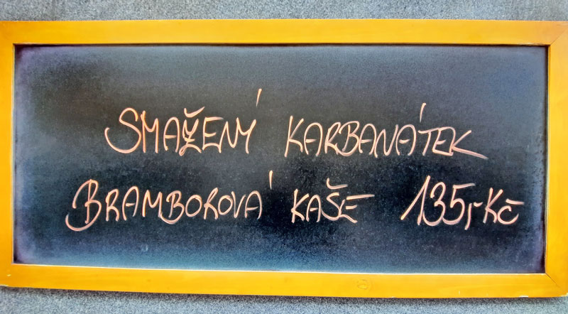 sign on a restaurant lunch menu board advertising smazeny karbanatek