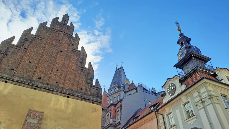 the prague old new synagogue gothic gable wall on the left and the prague jewish town hall on the right