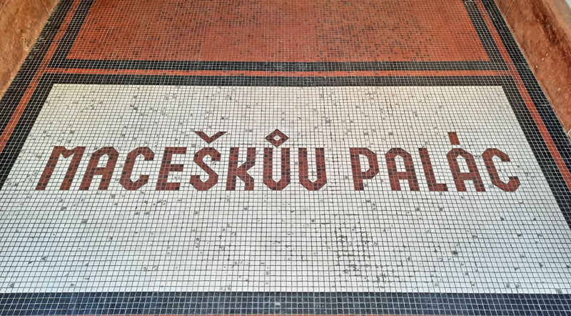 ground mosaic at the prague theatre le royal which says maceskuv palace