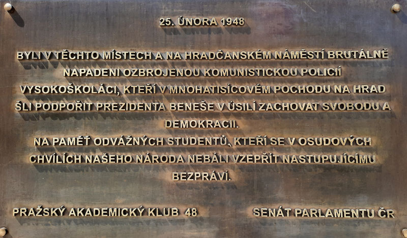 a memorial plaque in prague nerudova street marking a place where communist security police brutally stopped a student protest