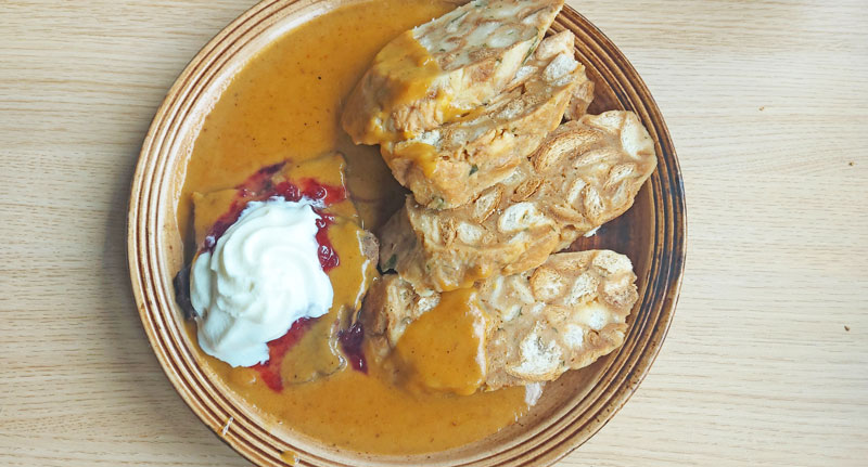 beef sirloin svickova with bread dumplings, cream and cranberry jam