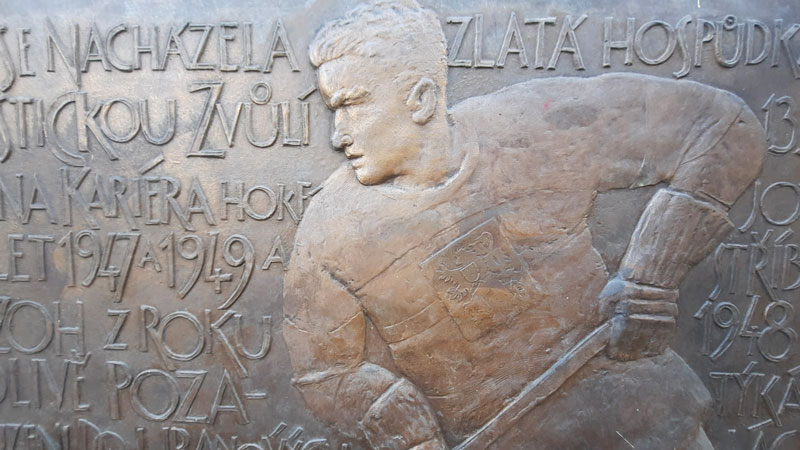 bronze memorial to czech ice hockey players with central character bohumil modry