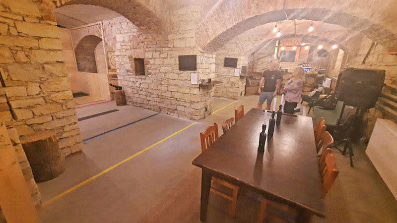 house of axes basement showing tables bar and throwing lane