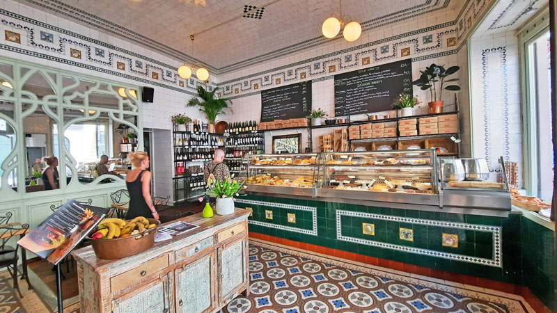 interior decor of prague cafe au gourmand in the style of a french patisserie