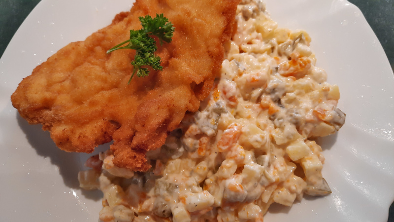 fried pork schnitzel with potato salad