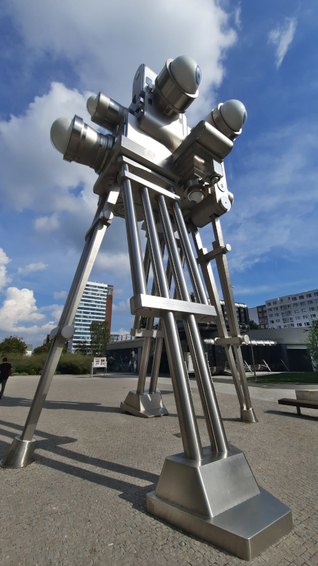 david cerny trifot sculpture in prague with multiple vintage cameras and eyeball lens standing 12 metres tall with supports