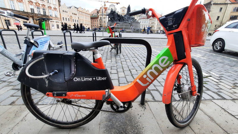 orange lime jump e-bike parked on the Old Town Square in Prague