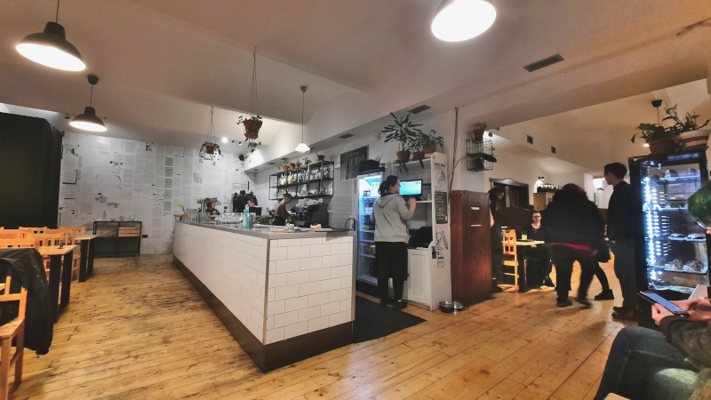 prague bistro strecha interior with wood floor and chairs and tiled bar