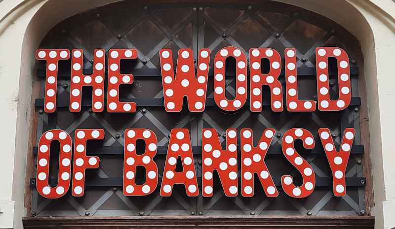 sign saying world of banksy in prague
