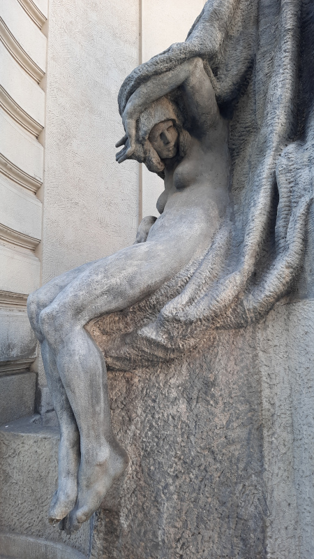 sculpture of a woman under the prague darth vader statue at the nova radnice