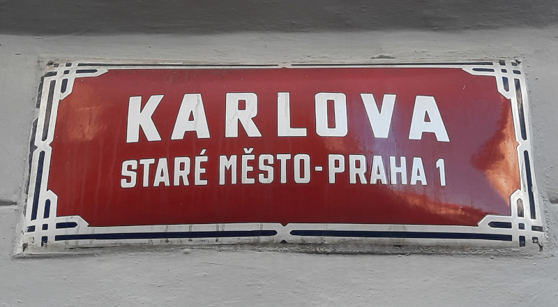 prague street sign that says karlova, old town, prague 1