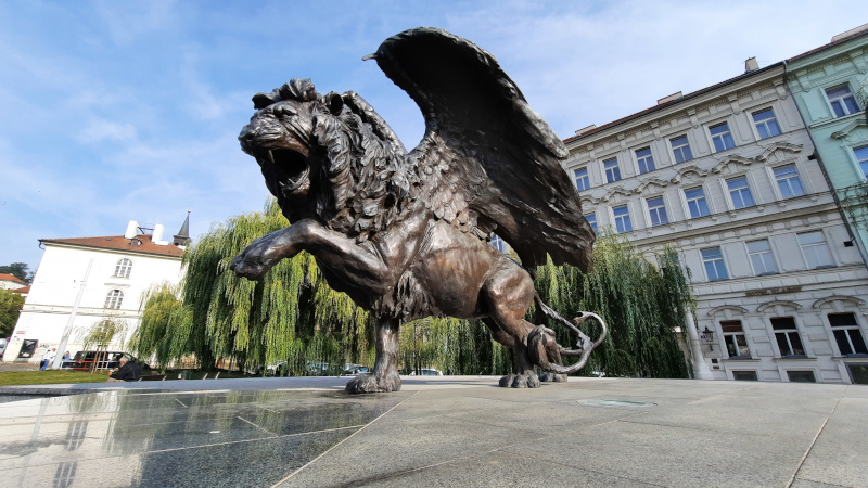 the winged lion in prague cast in bronze on a granite plinth