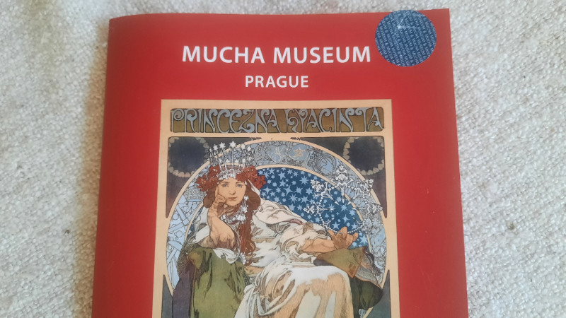 Alfons Mucha Museum exhibition guide with poster of princess hyacinth