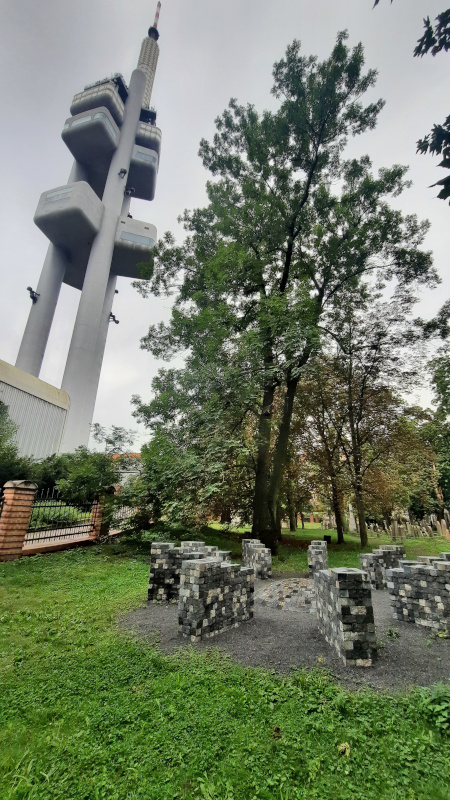 return of the stones memorial in prague zizkov old jewish cemetery with tv tower in background