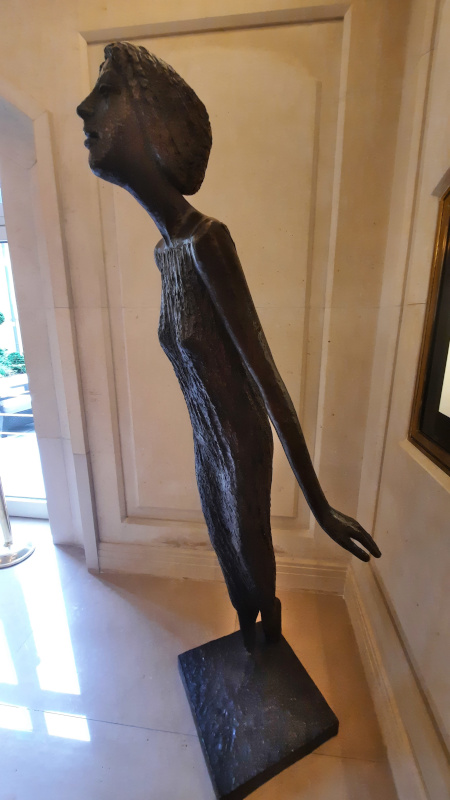 olbram zoubek thin woman in the hotel four seasons lobby