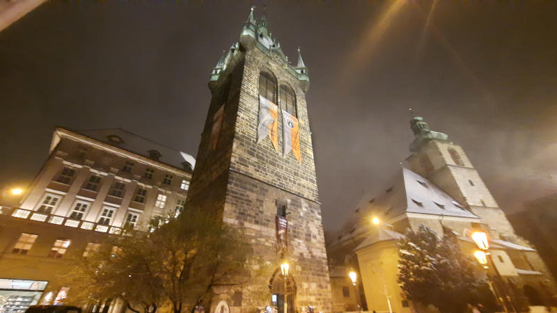 henry's tower in prague at night with snow on roof